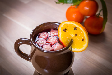 Ginger and herbs tea with slice of orange