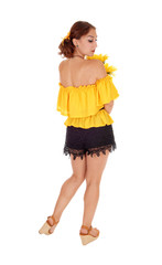 Woman with sunflowers looking over shoulder.