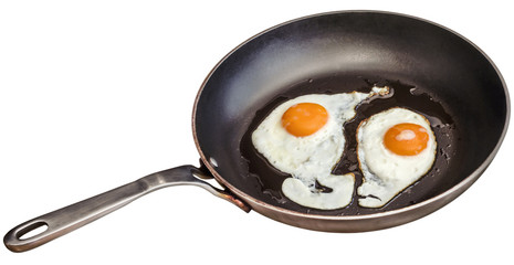 Sunny Side Up Eggs Fried In Old Heavy Duty Teflon Frying Pan Isolated On White Background