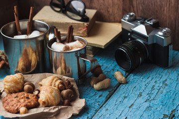 Metal mugs with cacao and marshmallows