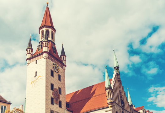 Old Townhall With Red Roof And Cloudy Background