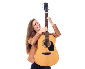 Fototapeta premium Young woman holding a guitar 