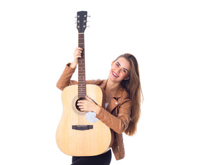 Obraz premium Young woman holding a guitar 