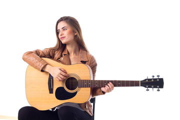 Fototapeta premium Young woman holding a guitar 