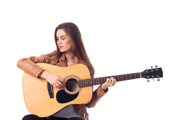 Obraz premium Young woman holding a guitar 