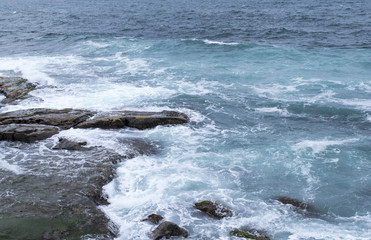 Fototapeta na wymiar seascape, turquoise waters of the ocean beating on the coastal rocks