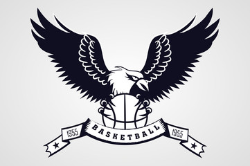 Naklejka premium wild eagle with the ball in his paws. sports the emblem of the basketball team. logo, icon. ribbon with the inscription.black and white tattoo