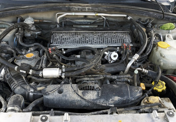 Obraz na płótnie Canvas Old used engine of a car. Internal design of engine. Car engine part.
