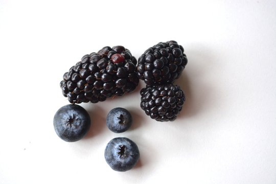 Three blackberries and three blueberries