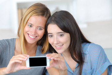 two women friends take selfie