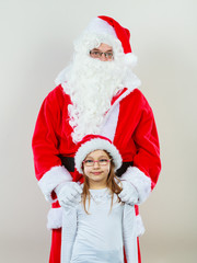 Christmas Santa Claus with girl in hat