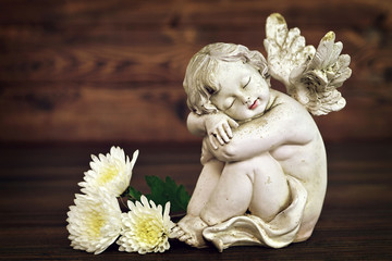 Angel figurine and white flowers