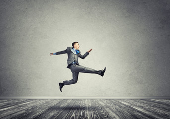 Businessman jumping high