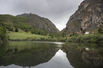 Fototapeta na wymiar Views of El Valle Reservoir, in Valle del Lago, Somiedo Nature Reserve. It is located in the central area of the Cantabrian Mountains in the Principality of Asturias in northern Spain