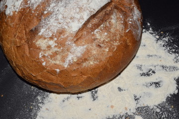 bread flour on the black background