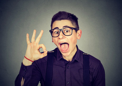 Nerdy funny man showing ok sign