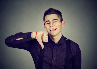 sarcastic man showing thumbs down happy someone made mistake