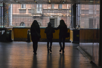 Silhouettes in the underground passage 