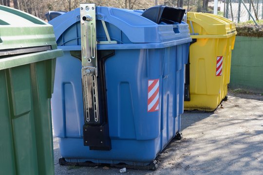 yellow, blue and green street garbage containers