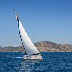 Fototapeta na wymiar Boat competitor of sailing regatta. Yachting.
