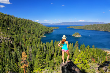 Naklejka premium Young woman enjoying the view of Emerald Bay at Lake Tahoe, Cali