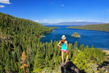 Young woman enjoying the view of Emerald Bay at Lake Tahoe, Cali