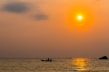 silhouette photography of Thailand sea , a fishing boat against sun rise
