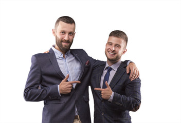 Two men in suits hugging