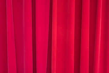 Red velvet curtain backdrop on the stage.