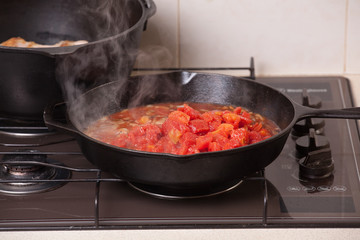 Ingredients being added to a home cooked meal