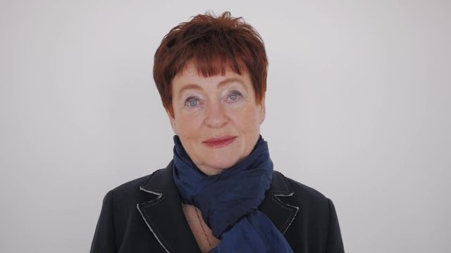 Looking old woman portrait on a white background happy portrait