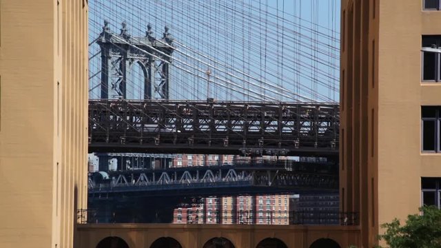Manhattan Bridge On Clear Day NYC Between Buildings