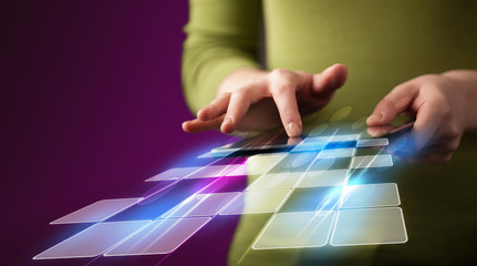 Fototapeta premium Close up of hand holding tablet with cyber application