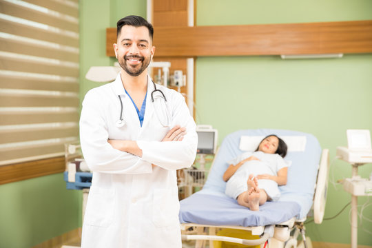 Hispanic doctor with a pregnant patient
