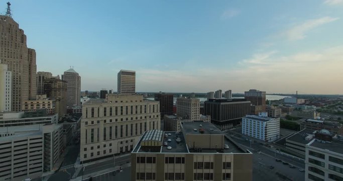 Timelapse of the Detroit skyline from day to night, highlighting the illumination of the buildings during sunset and twilight 