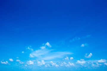 blue sky background with tiny clouds