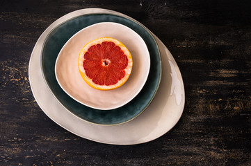 Grapefruit slice on rustic plates