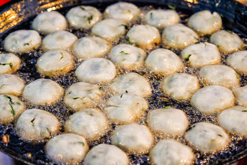Fried garlic chive dumplings at a street food market