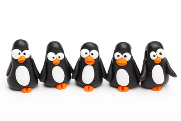 Group of clay toys (penguin). Isolated on white background, hori