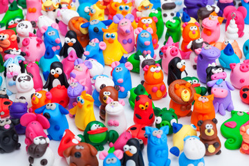 Large group of clay toys. Wide shot of many toys