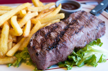 juicy steak beef meat with tomato and french fries