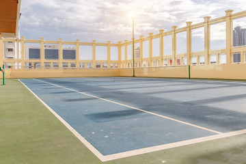 Tennis court at a private estate in the sunshine day