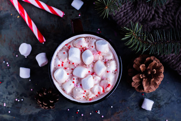 Hot Chocolate with Marshmallows in a Ceramic Cup on table. Festive decoration. Xmas concept. Top view. Winter holiday drink