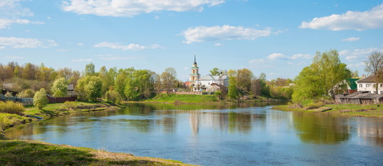 Fototapeta na wymiar Provincial landscape with a temple on the banks of the river