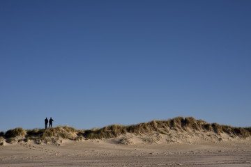 Fototapeta na wymiar Two people on Danish dunes