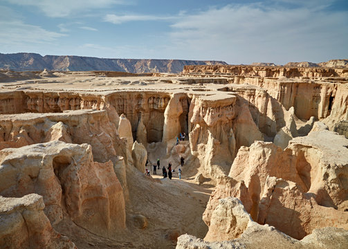 QESHM ISLAND, IRAN - Febrary 28, 2016: People walking through Stars Valley. Mountain range at Qeshm Island, Iran