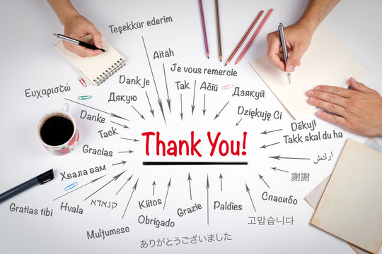 Thank You in different languages of the world. The meeting at the white office table.