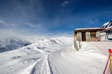Fototapeta premium Alpine winter mountain landscape. French Alps with snow.