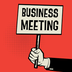 Poster in hand, business concept with text Business Meeting