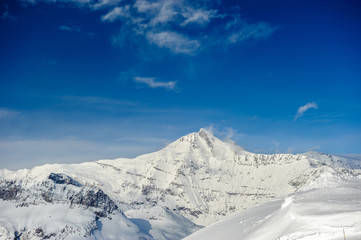 Fototapeta premium Alpine winter mountain landscape. French Alps with snow.
